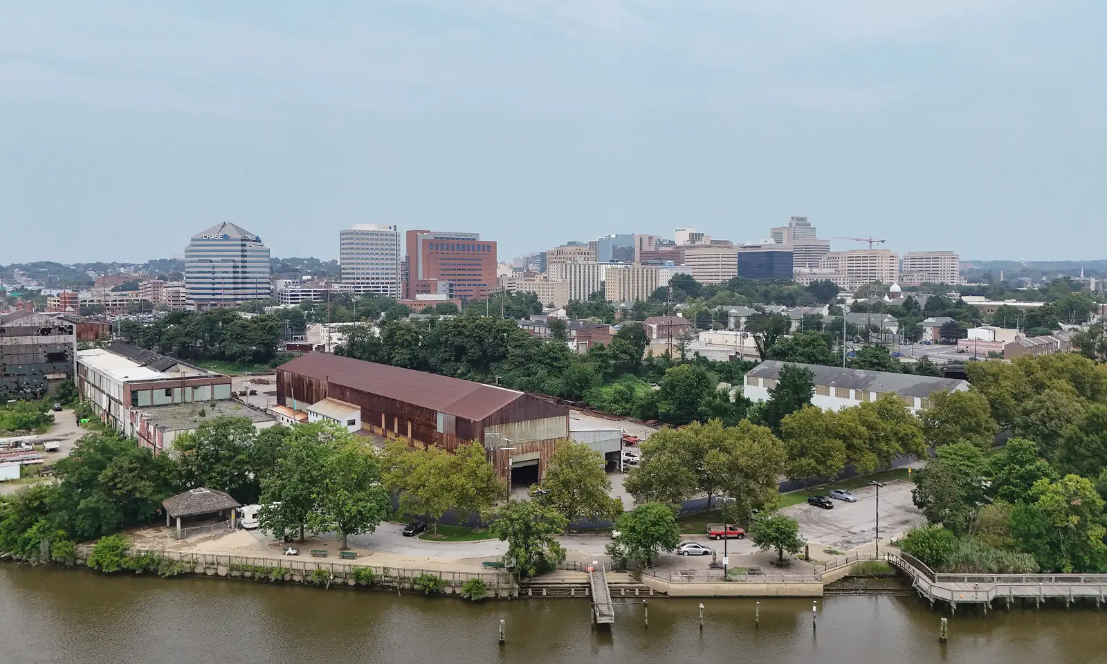 Aerial daylight view of the Wilmington, Delaware skyline showing downtown high-rise buildings along the riverfront