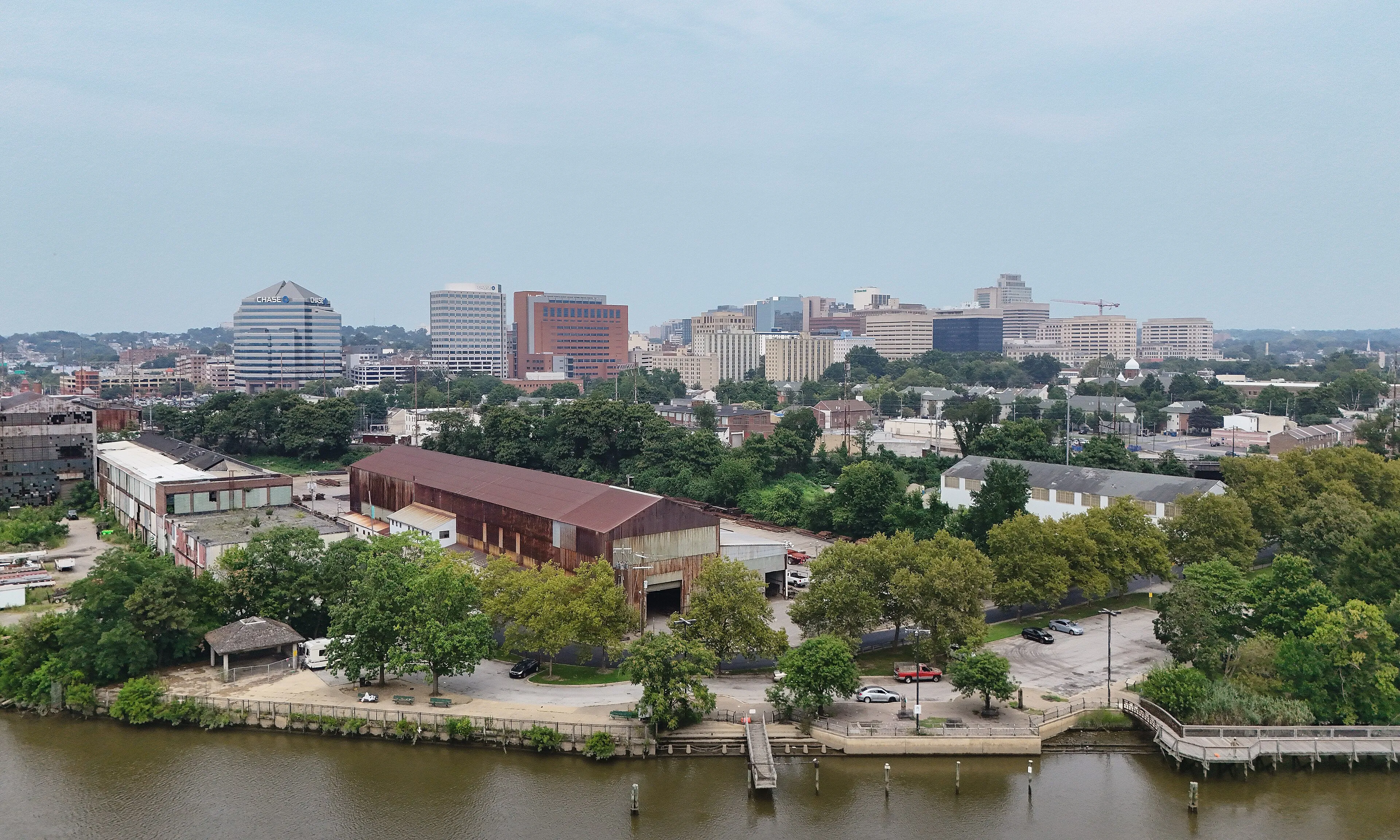 Aerial daylight view of the Wilmington, Delaware skyline showing downtown high-rise buildings along the riverfront