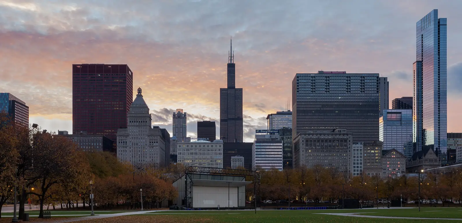 Panoramic view of the Chicago, Illinois skyline at dusk, showing downtown skyscrapers along Lake Michigan