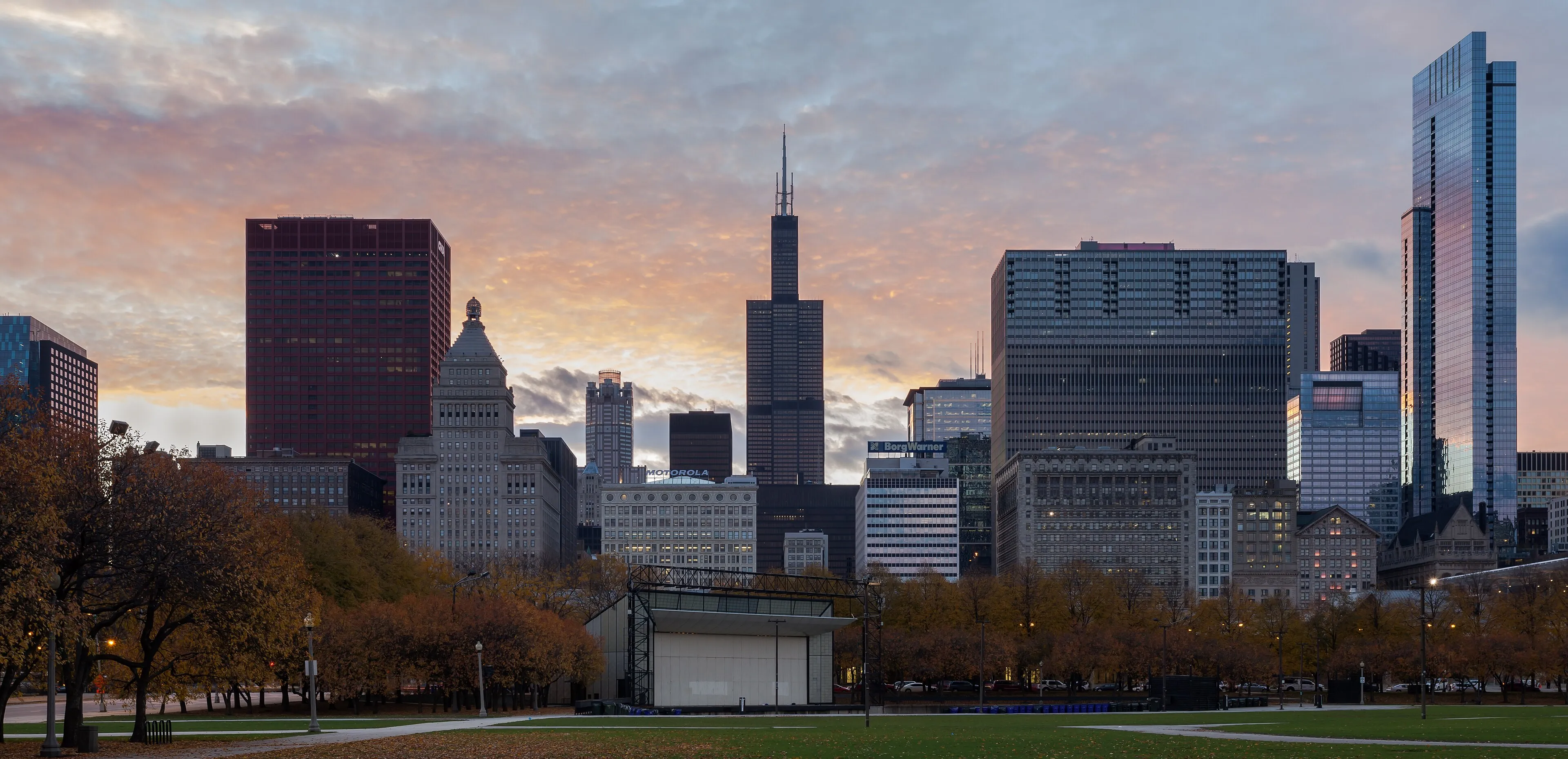 Panoramic view of the Chicago, Illinois skyline at dusk, showing downtown skyscrapers along Lake Michigan
