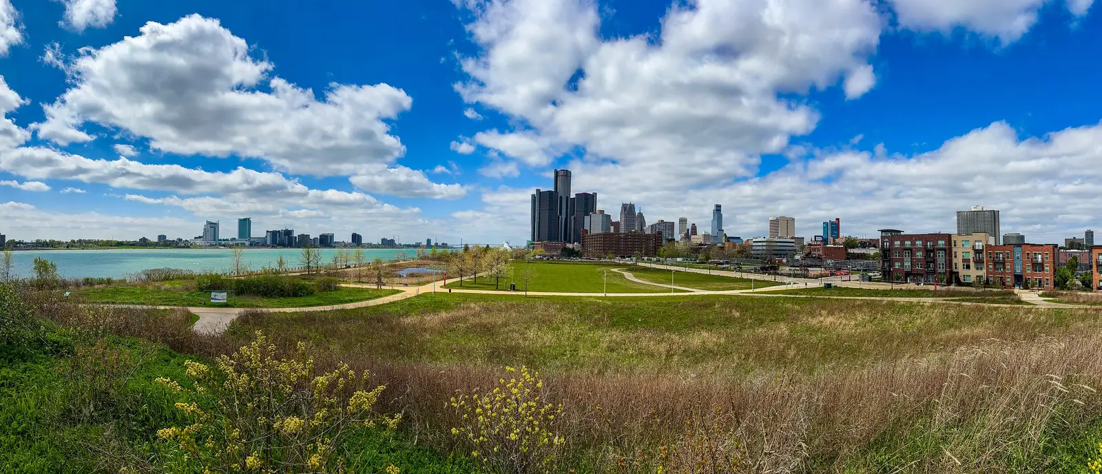 Panoramic view of the Detroit skyline from the riverwalk with the Windsor, Ontario skyline visible across the Detroit River, Michigan