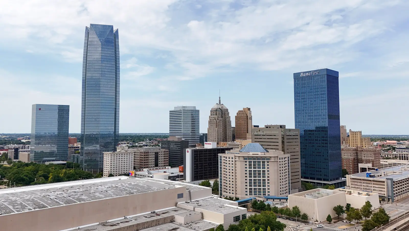 Aerial drone view of the downtown Oklahoma City skyline with modern skyscrapers under daylight, Oklahoma