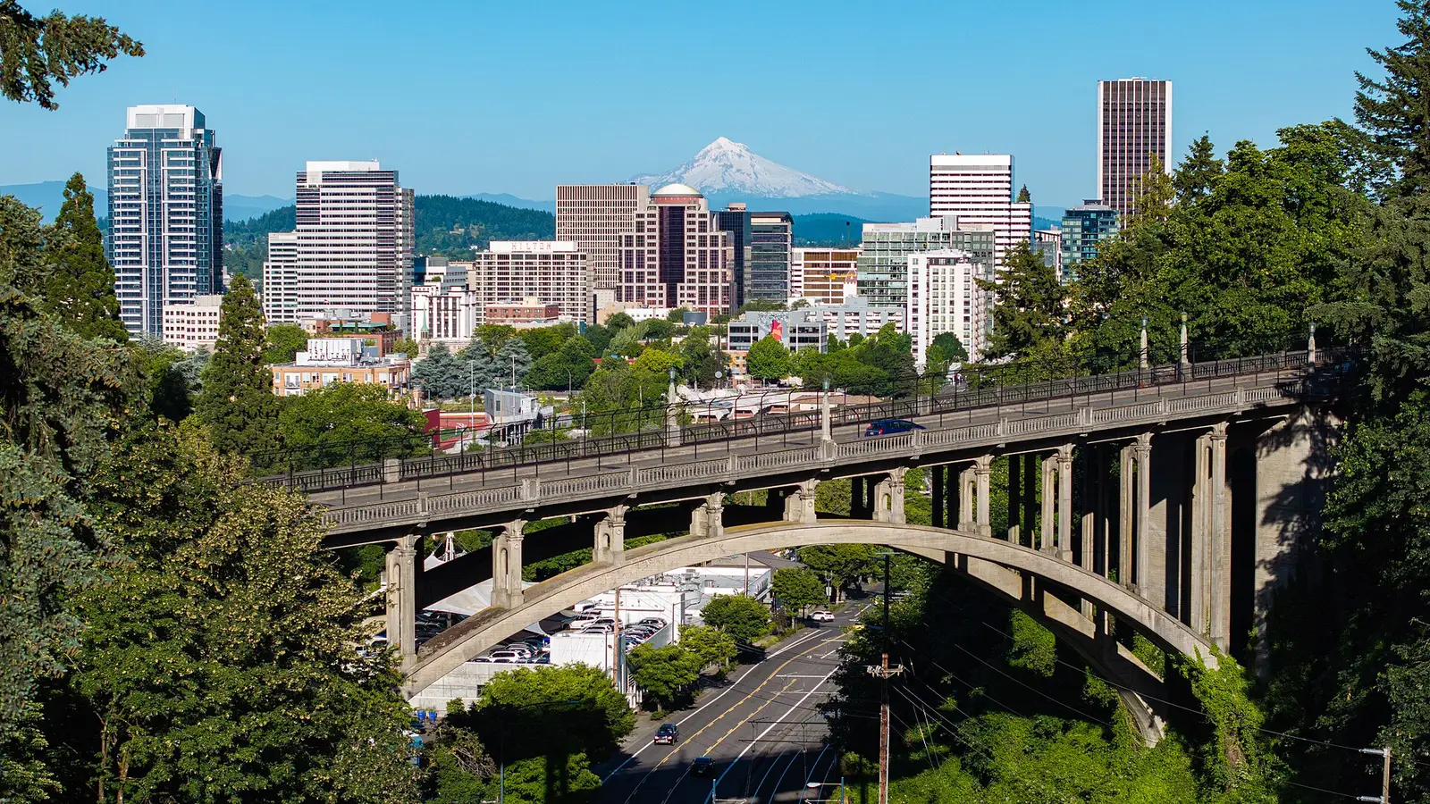 The downtown Portland skyline with the Vista Bridge and snow-capped Mount Hood behind it, Oregon