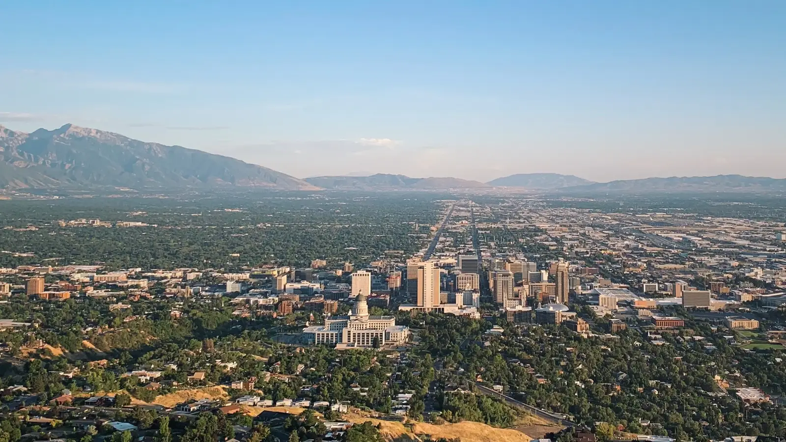 Salt Lake City skyline with downtown high-rises, the state capitol, and the Wasatch Mountains rising behind the city, Utah