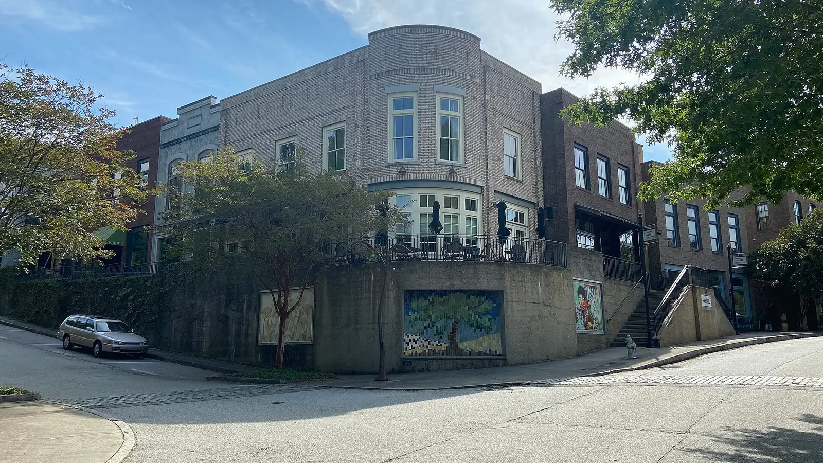 Brick storefronts of the Hill restaurant and shops at Serenbe in Chattahoochee Hills, Georgia