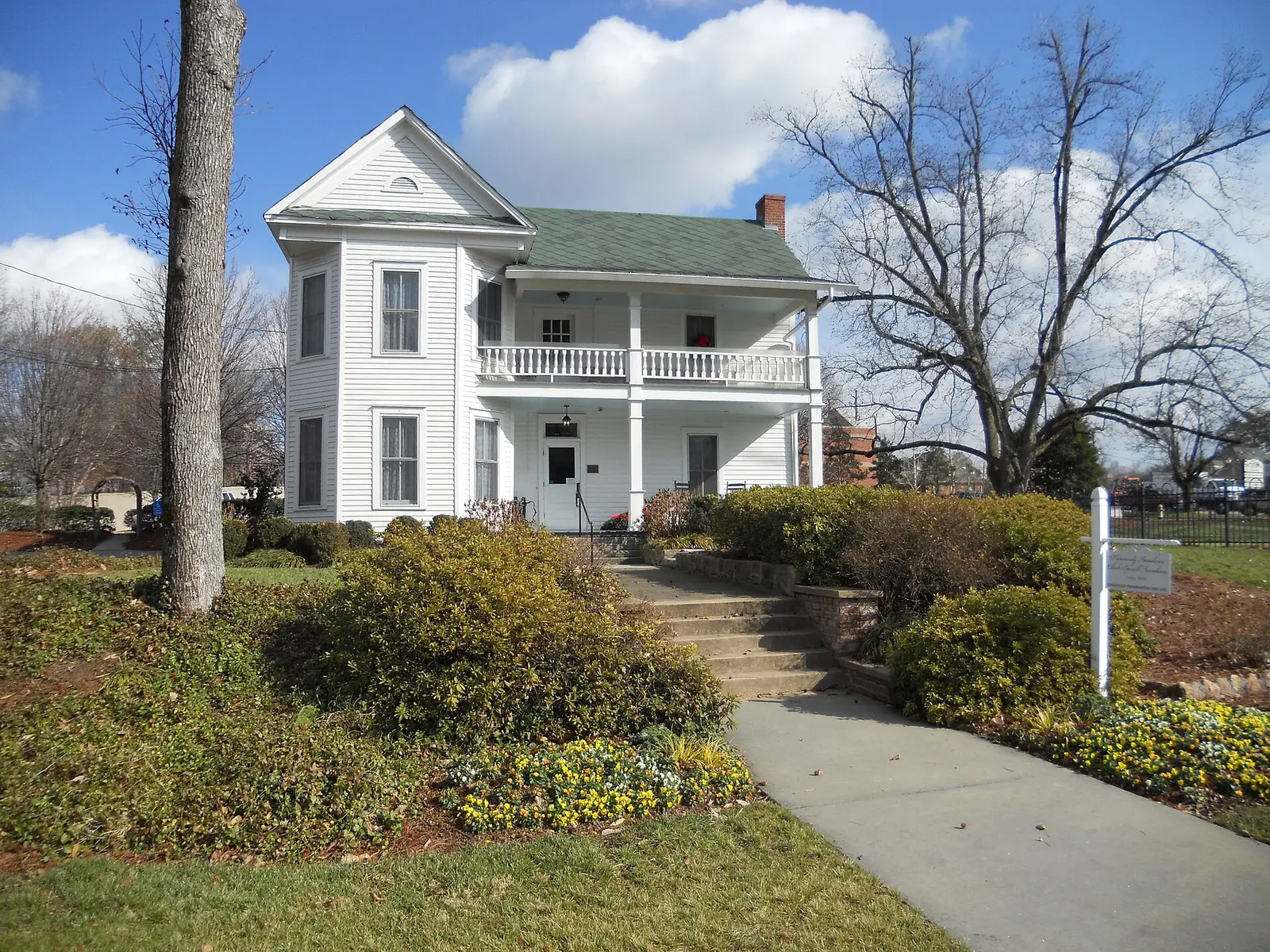 The historic Cheek-Spruill Farmhouse, a white two-story landmark, in Dunwoody, Georgia
