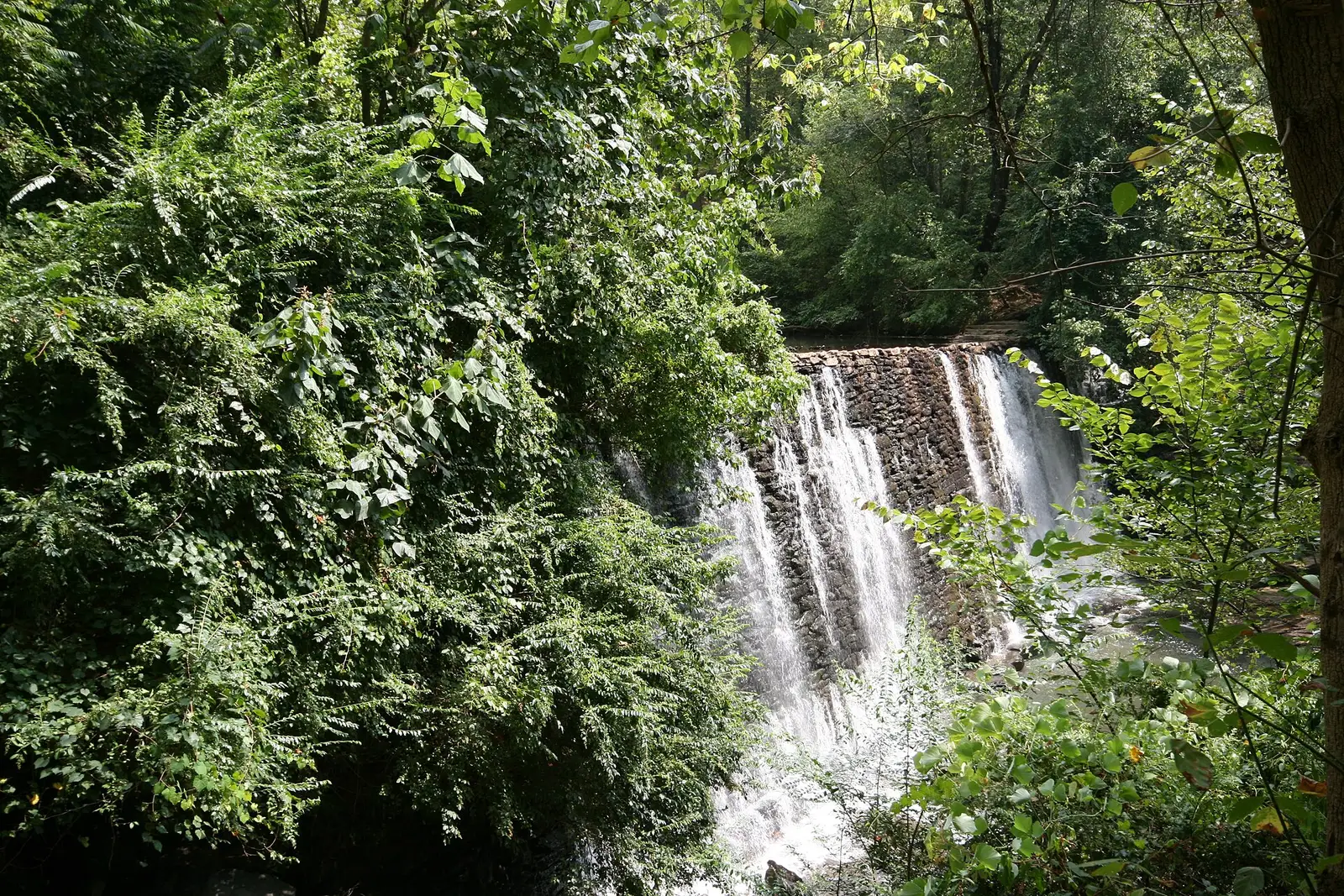 Waterfall over the historic mill dam on Vickery Creek at Roswell Mill in Roswell, Georgia