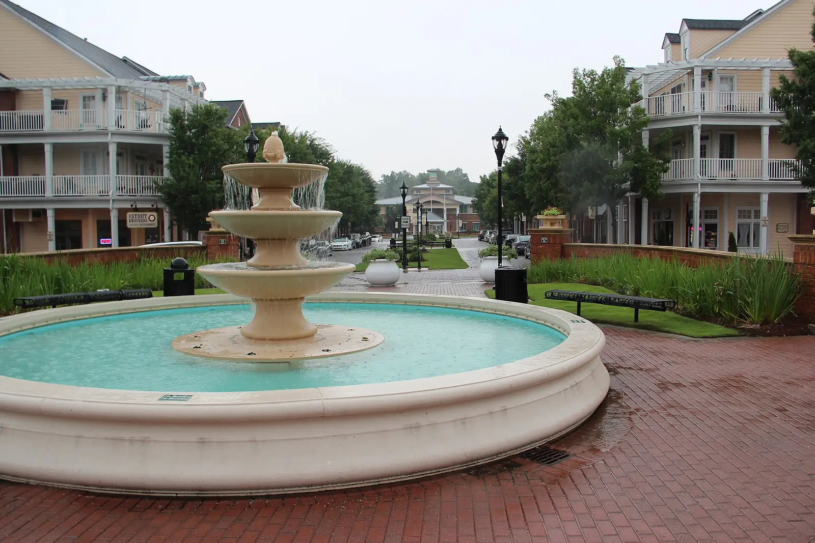 The fountain and clapboard storefronts of Smyrna Market Village in downtown Smyrna, Georgia