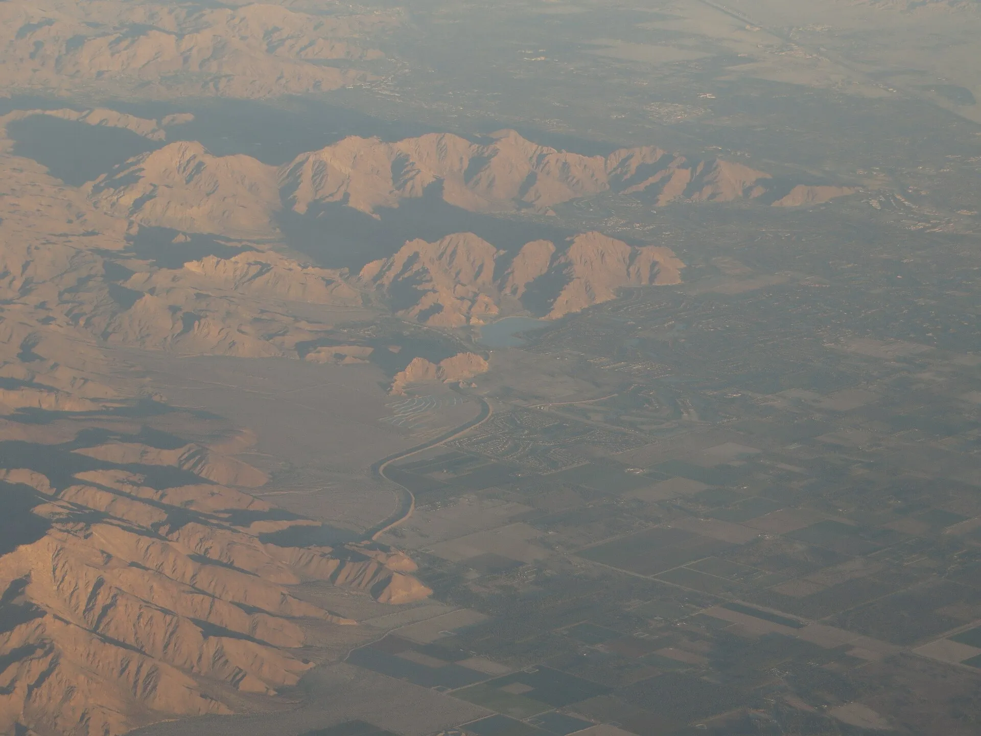 Aerial view of La Quinta, California, with desert golf communities beneath the Santa Rosa Mountains