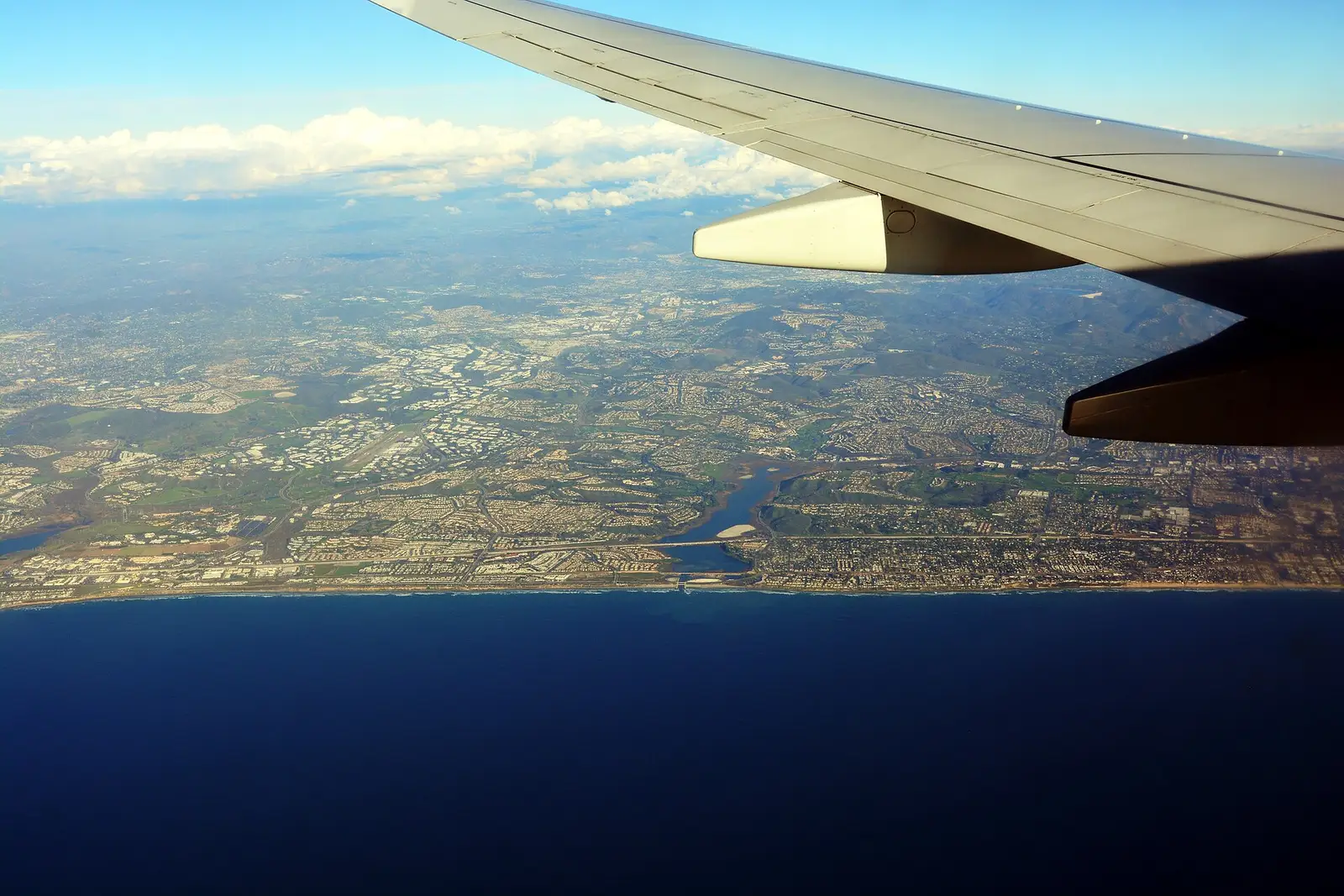 Aerial view of the San Diego County coastline near Carlsbad, with Batiquitos Lagoon and coastal neighborhoods