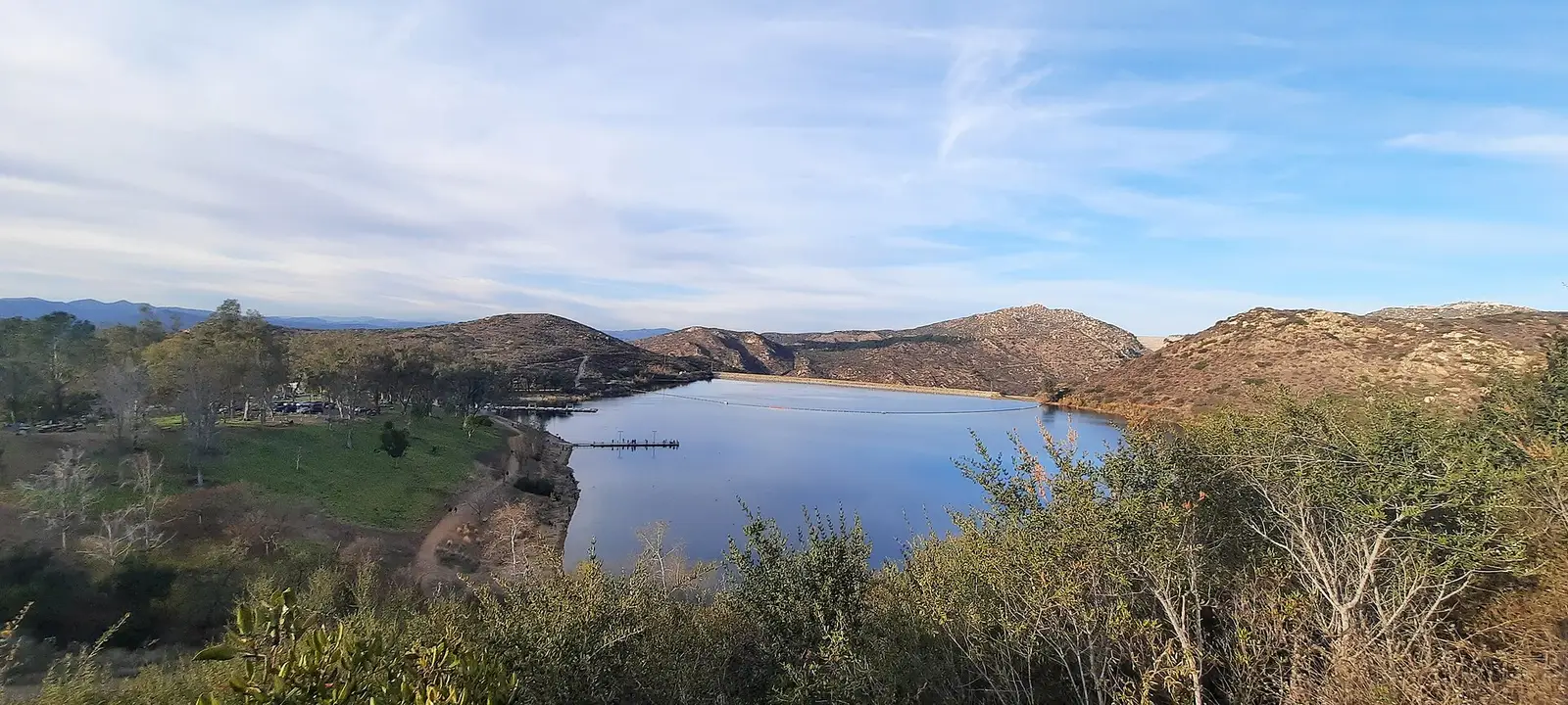 Elevated view over Lake Poway and the surrounding chaparral hills in Poway, California